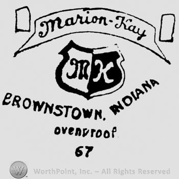 Marion-Kay written on a ribbon above, initials M K written on a shield. Brownstown, Indiana written below