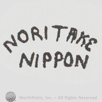 The word Noritake written in a slight arch with the word Nippon below