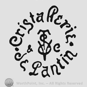 Stylish writing "Crista Perie Je Pantin" around a monogram
