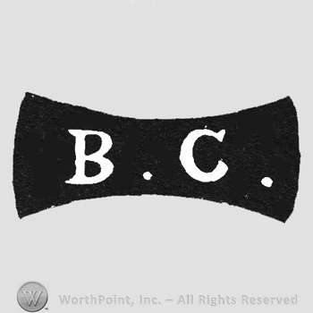 Black label with white initials inside BC