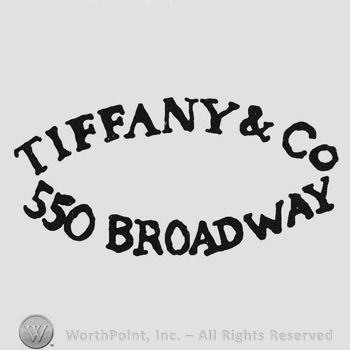 Curved capital bold writing Tiffany & Co up 550 Broadway under