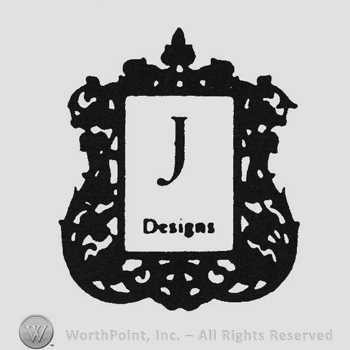 Writing J Designs on a sheep of peper inside a stylish frame