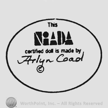 Writing This Niada certified doll is made by Arlyn Coad copyright, all inside an oval