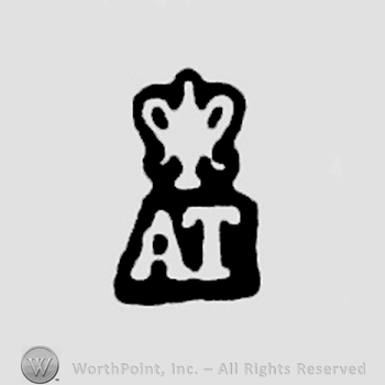 AT, trophy above