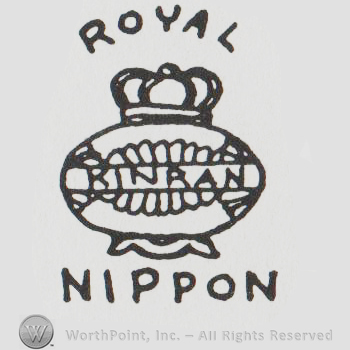 An urn, pot or vase with a crown with the word Kinran written across the middle.  The word Royal is written above and Nippon is written below.
