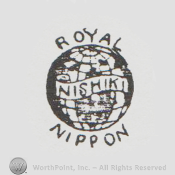 A globe with a banner on it that has written Nishiki.  The word Royal appears above the globe and Nippon below.