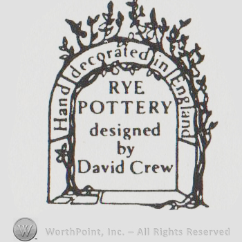 a gate with flowes and the text HAND DECORATED IN ENGLAND RYE POTTERY DESIGNED BY DAVID CREW