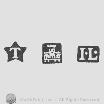 T letter and Castle and IL, pellet between