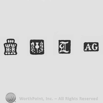 Castle and goblet in a wreath and date-letter T and AG
