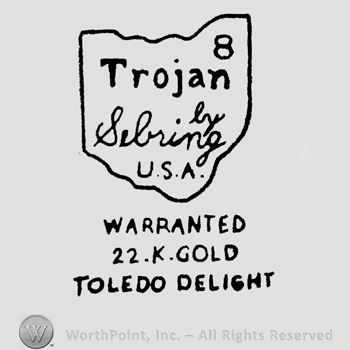 8 above Trojan written above By Sebring written above U.S.A., all inside a frame, above Warranted written above 22 K. Gold written above Toledo Delight
