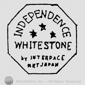Independence written arched above 3 stars, above Whitestone written above By Interpace written above MKT Japan, all in octogon shape frame